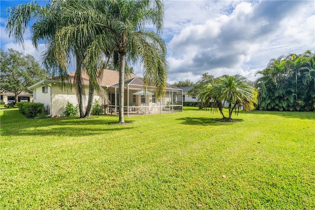 view of yard featuring a lanai