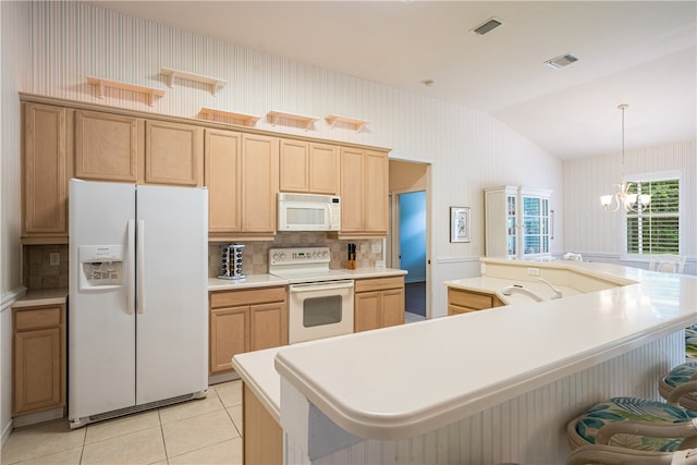 kitchen with a large island, decorative light fixtures, light tile patterned floors, white appliances, and lofted ceiling