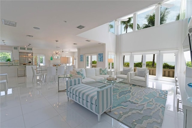 116 Ocean Way, Vero Beach, FL 32963 - living area with tile patterned floors, a chandelier, and recessed lighting