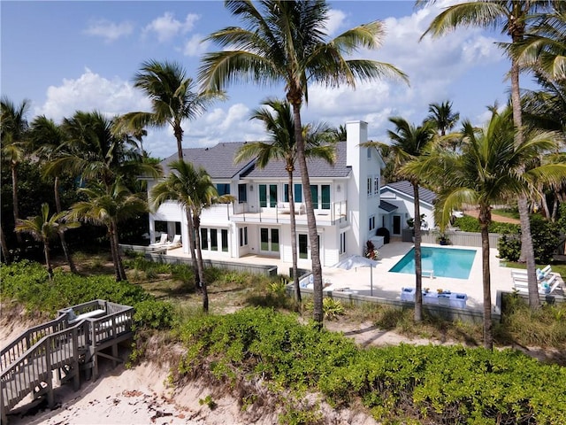 116 Ocean Way, Vero Beach, FL 32963 - back of property featuring a balcony, stucco siding, and a patio