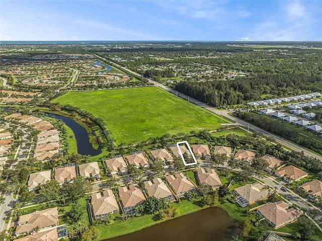 4951 Corsica Sq, Vero Beach, FL 32967 - aerial view of property and surrounding area featuring nearby suburban area and a large body of water