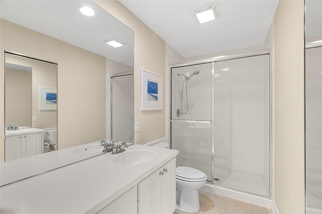 4951 Corsica Sq, Vero Beach, FL 32967 - bathroom featuring vanity, a stall shower, tile patterned flooring, and recessed lighting