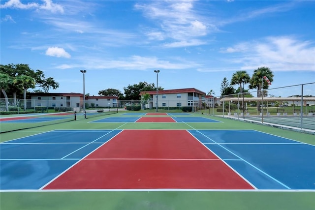 view of sport court with basketball hoop