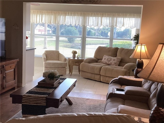 tiled living room with plenty of natural light