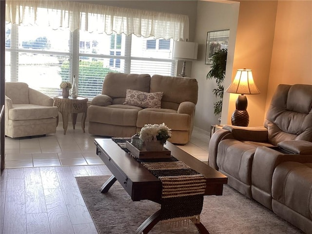 living room with plenty of natural light and light wood-type flooring