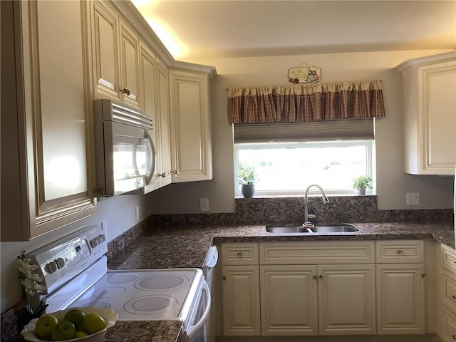 kitchen featuring white appliances and sink