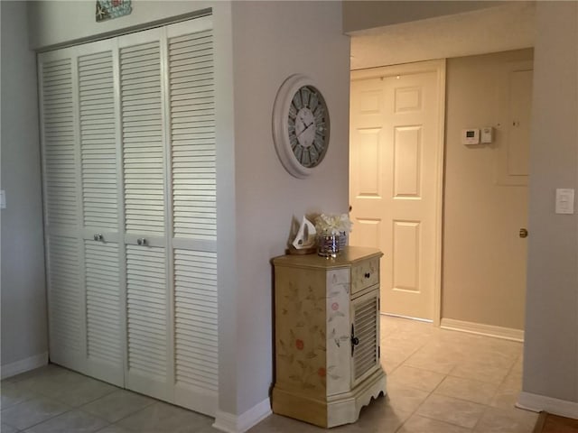 hallway featuring light tile patterned floors