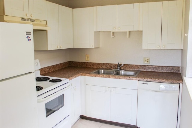 kitchen featuring white appliances, dark countertops, under cabinet range hood, white cabinetry, and a sink