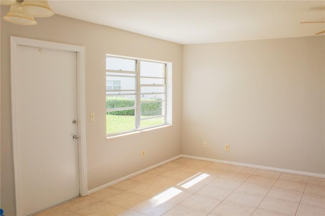 spare room featuring baseboards