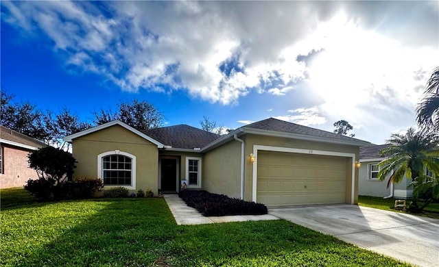 ranch-style home featuring a garage and a front yard