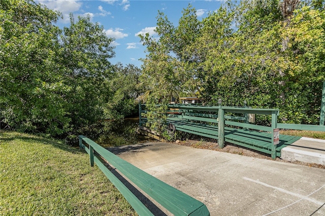 view of gate featuring a yard