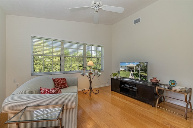 living area featuring ceiling fan and light hardwood / wood-style floors