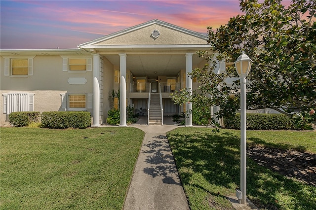 view of front of house with a lawn