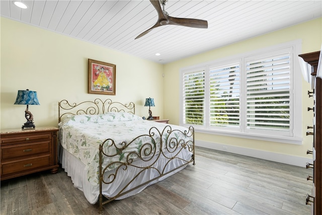 bedroom with hardwood / wood-style floors, ceiling fan, and wood ceiling