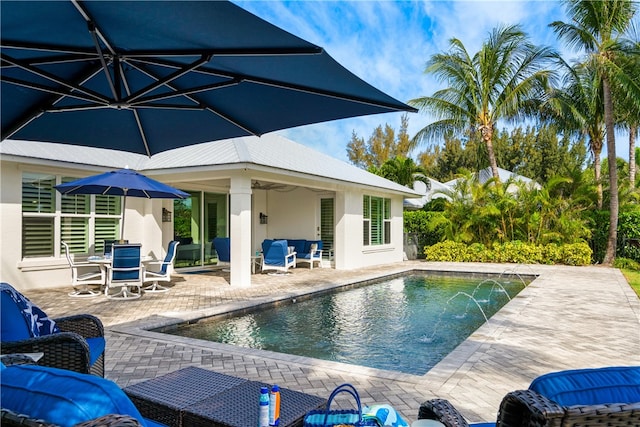 view of swimming pool featuring a patio area and pool water feature