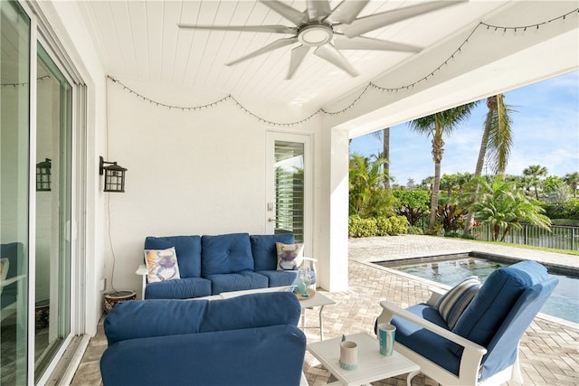 view of patio with a swimming pool, an outdoor living space, and ceiling fan