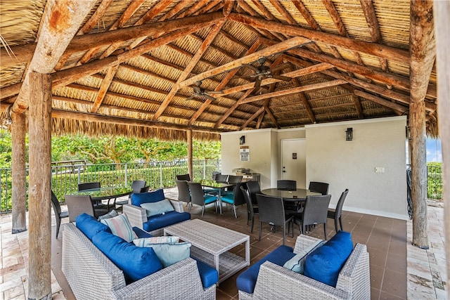 view of patio featuring ceiling fan, an outdoor hangout area, and a gazebo