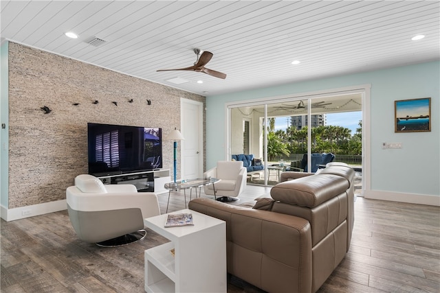 living room featuring wood-type flooring, ceiling fan, and wood ceiling