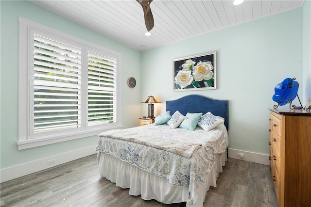 bedroom featuring hardwood / wood-style floors, ceiling fan, and wooden ceiling