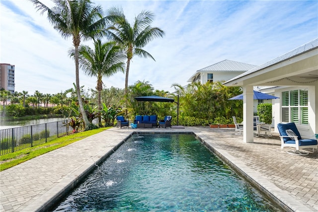 view of pool featuring a patio and pool water feature