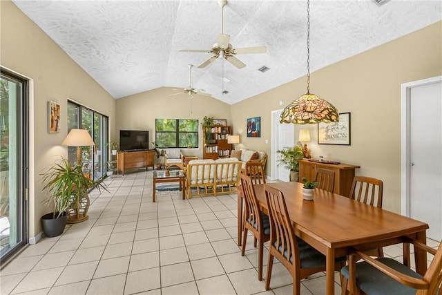 dining area with lofted ceiling, visible vents, a textured ceiling, and light tile patterned floors