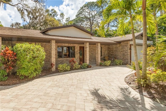 view of front of home featuring brick siding