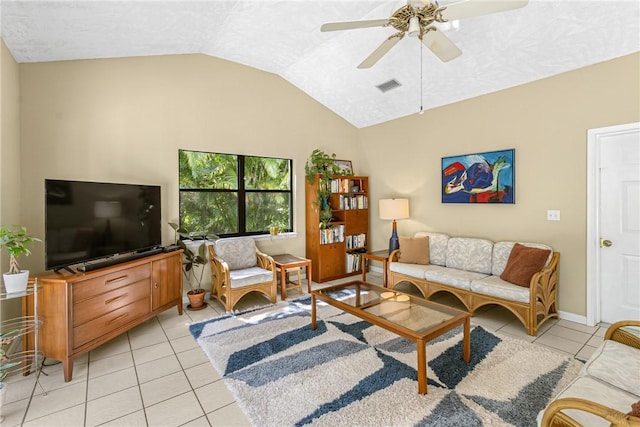 living room featuring lofted ceiling, ceiling fan, light tile patterned flooring, and visible vents