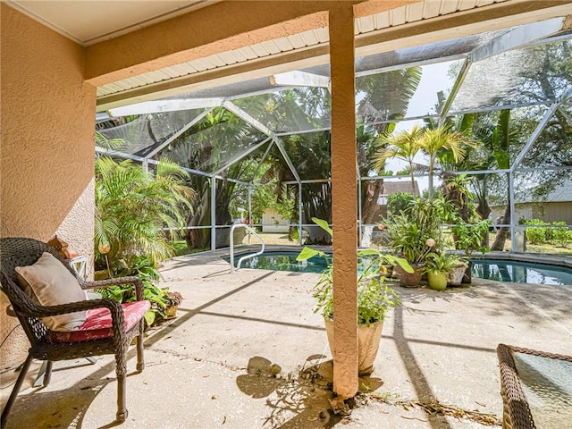 view of patio / terrace with an outdoor pool and a lanai