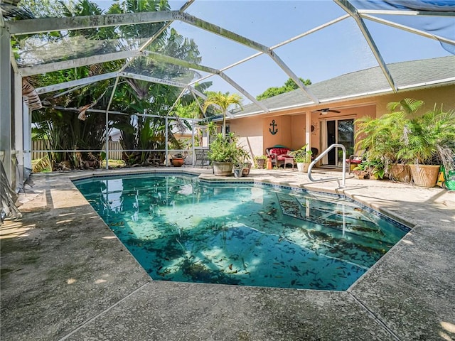 pool with a patio area and a ceiling fan