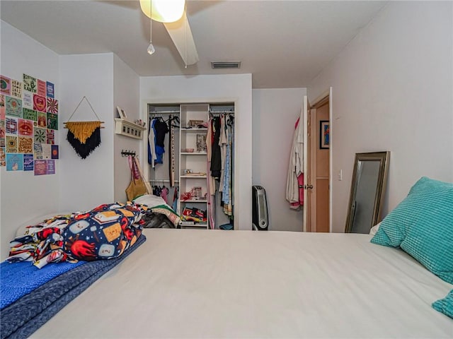 bedroom featuring visible vents, a closet, and ceiling fan