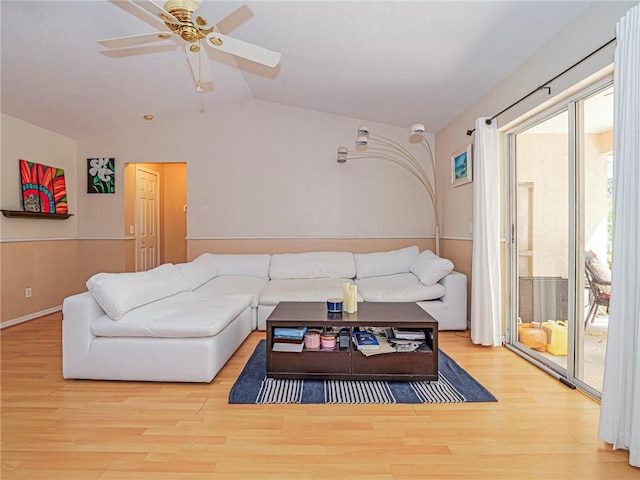 living room featuring vaulted ceiling, wood finished floors, and ceiling fan