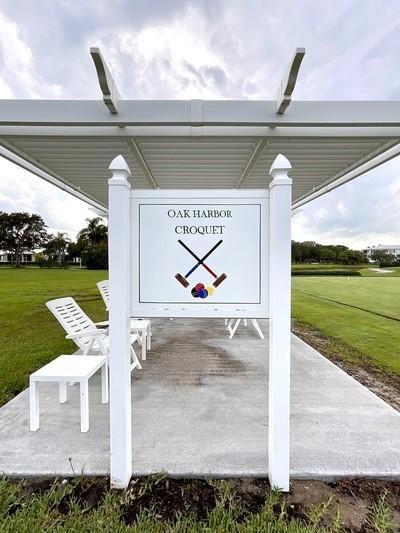 1510 Oak Harbor Blvd Unit 202, Vero Beach, FL 32967 - community sign with a yard