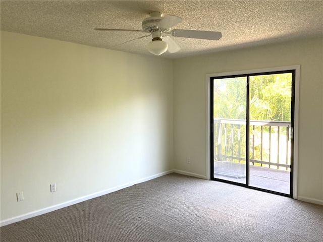 carpeted spare room featuring ceiling fan and a textured ceiling