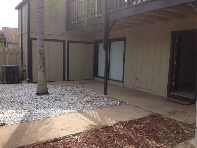 exterior space with central AC unit and a balcony