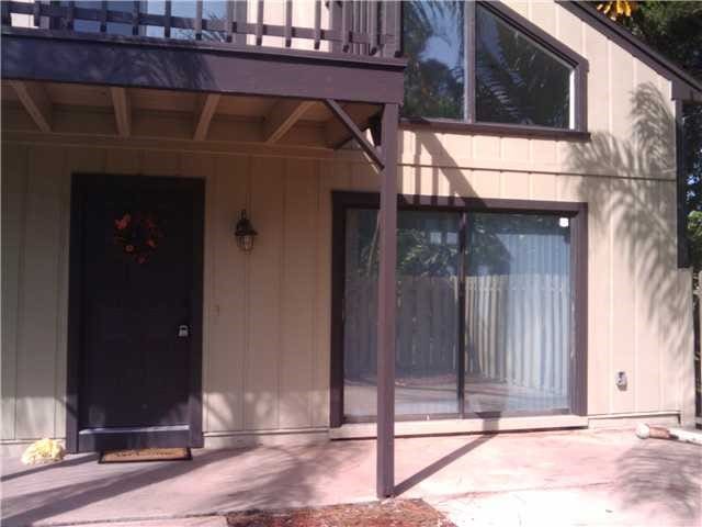 entrance to property with a patio area and a balcony