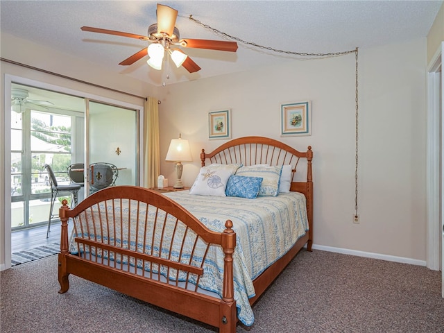 carpeted bedroom with a textured ceiling, access to outside, and ceiling fan