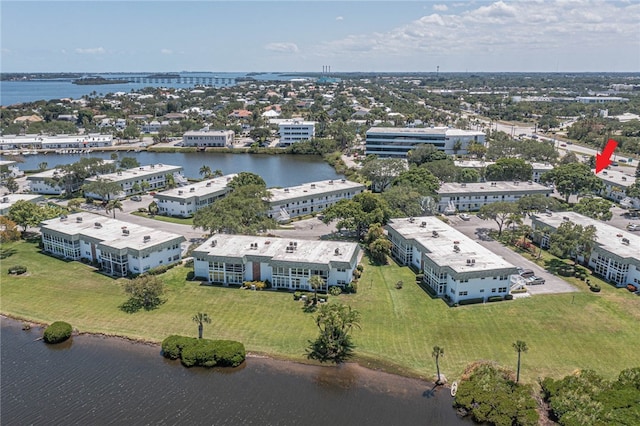 birds eye view of property with a water view