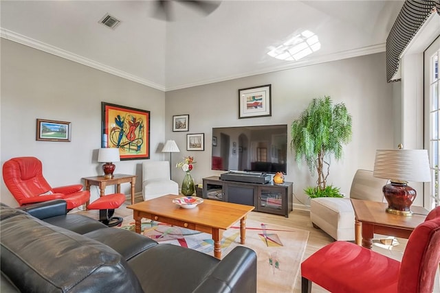 living room with ceiling fan and ornamental molding