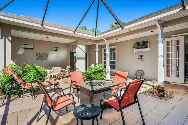 view of patio with french doors and an outdoor fire pit