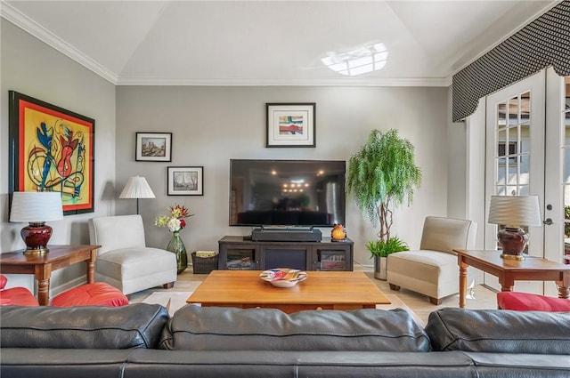 living room with crown molding, light hardwood / wood-style floors, and vaulted ceiling