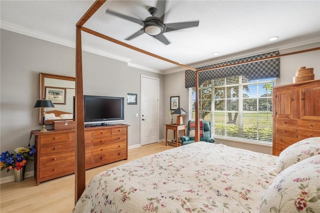 bedroom featuring ceiling fan, crown molding, and light hardwood / wood-style flooring