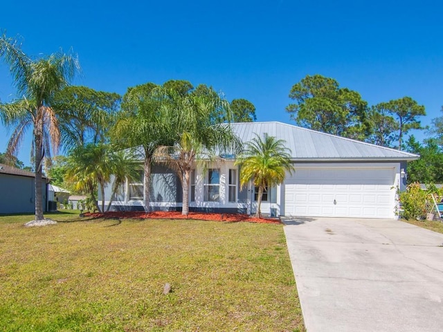 single story home featuring stucco siding, concrete driveway, a front yard, and a garage