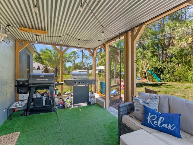 view of patio / terrace with a grill and a playground