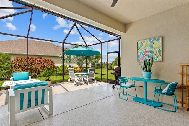 view of patio / terrace featuring a lanai and a grill