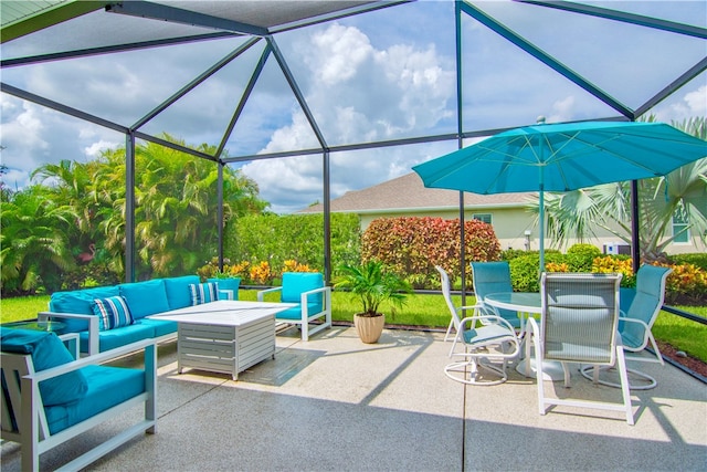 view of patio featuring glass enclosure and an outdoor hangout area