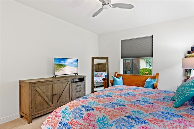 bedroom featuring light colored carpet and ceiling fan