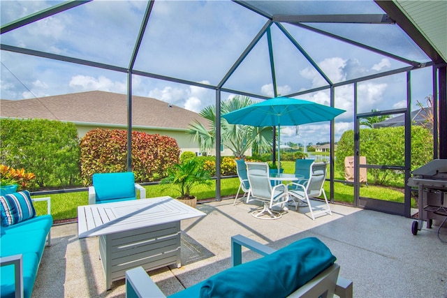 view of patio / terrace featuring a lanai