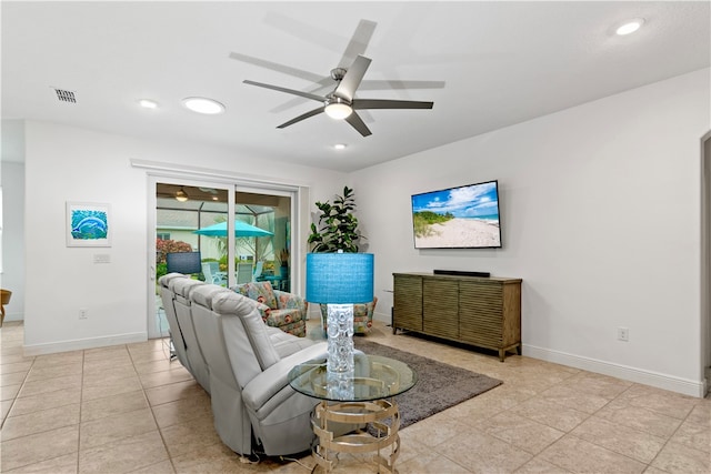 tiled living room featuring ceiling fan