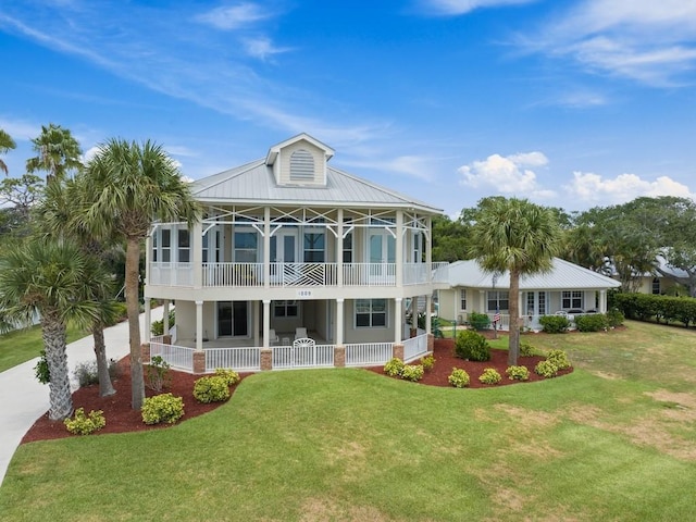 back of property featuring a lawn