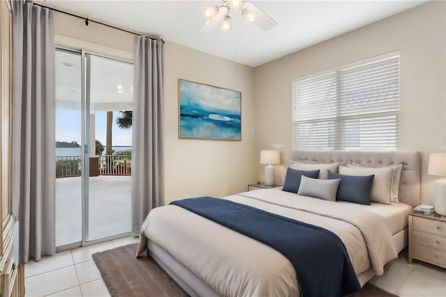 bedroom with ceiling fan, light tile patterned floors, and access to outside